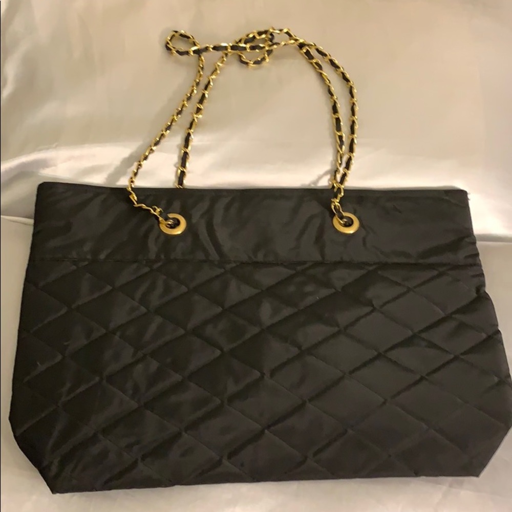 A black and gold tote bag.